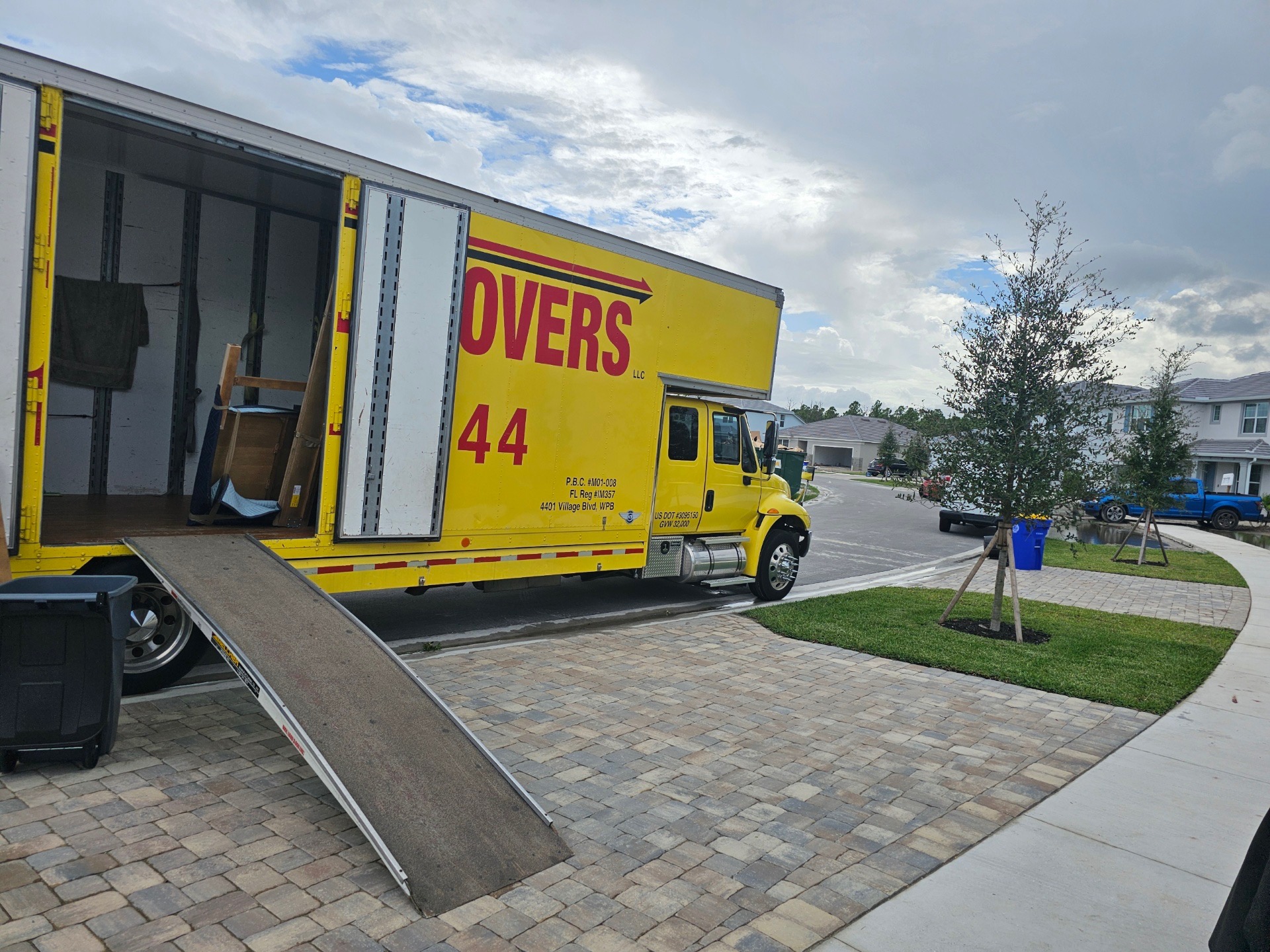Hall's Local Movers team carefully moving furniture in West Palm Beach